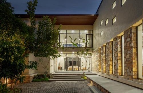 Bedla Villa | SaffronStays Camelot by the Lake - 3BR villa with glass walls, TT, projector, and gardens, Udaipur