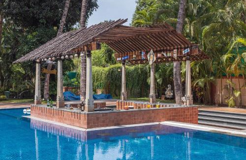 Alibaug Villa | SaffronStays Casa Del Palms - 8BR luxury pool villa with gazebo, pickleball, bar & lawns near Nagaon Beach