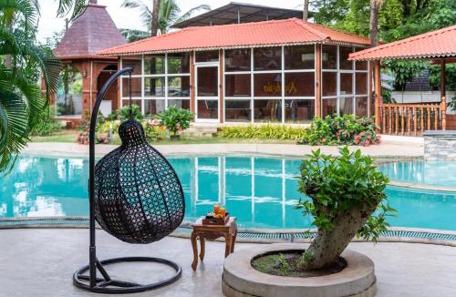 Kihim Villa | SaffronStays Euphoria Shores - 6BR villa with bar counter, pool & lawns 400m from Kihim Beach in Alibaug