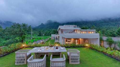 Karjat Villa | SaffronStays Grand Odyssy - 4BR luxury pool villa with sauna, game zone & lawn, perfect for weddings & parties in Karjat