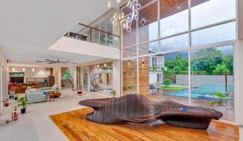 Karjat Villa | SaffronStays Grand Odyssy - 4BR luxury pool villa with sauna, game zone & lawn, perfect for weddings & parties in Karjat