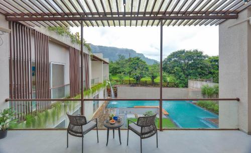 Karjat Villa | SaffronStays Grand Odyssy - 4BR luxury pool villa with sauna, game zone & lawn, perfect for weddings & parties in Karjat