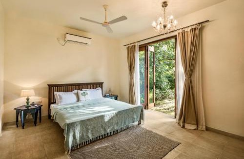 Alibaug Villa | SaffronStays Hacienda by the Sea - 5BR Spanish-style pet & elder-friendly pool villa with lawns, beach access & BBQ nights