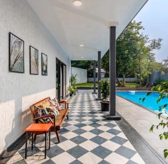 Alibaug Villa | SaffronStays Mayfair Gardens - 4BR pet-friendly pool villa with patio, den, board games & modern interiors near jetty