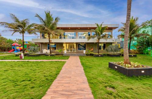 Bhiwandi Villa | SaffronStays Palm Paradise - twin 3BR villas with pool, slides, mango plantations & outdoor games near Mumbai