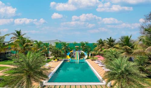Bhiwandi Villa | SaffronStays Palm Paradise - twin 3BR villas with pool, slides, mango plantations & outdoor games near Mumbai