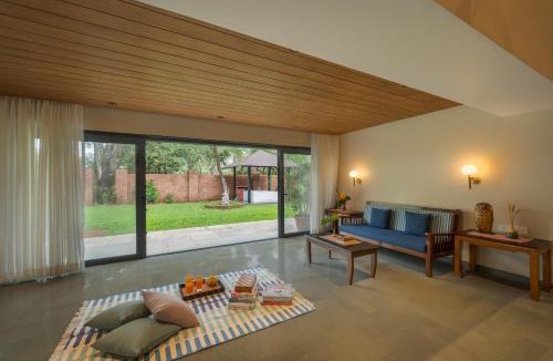 Wai Villa | SaffronStays Red Brick House - 3BR English-style villa with verandah dining, orchard lawn & classic charm