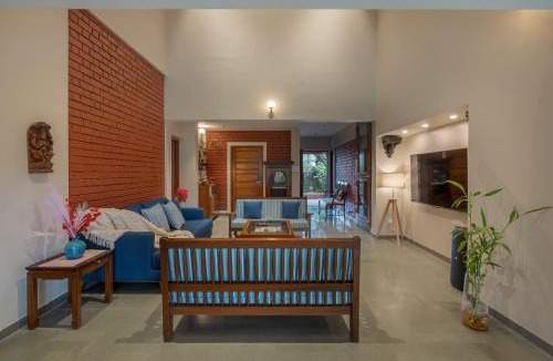 Wai Villa | SaffronStays Red Brick House - 3BR English-style villa with verandah dining, orchard lawn & classic charm