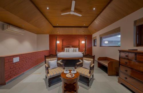 Wai Villa | SaffronStays Red Brick House - 3BR English-style villa with verandah dining, orchard lawn & classic charm