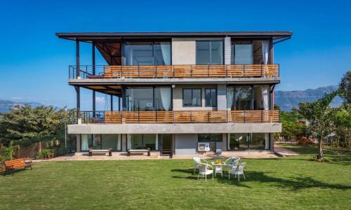 Paud Villa | SaffronStays Satori Perch Regal - 4BR Tuscan-style villa with pool, farm meals & 270 Degree Mulshi Lake views near Pune