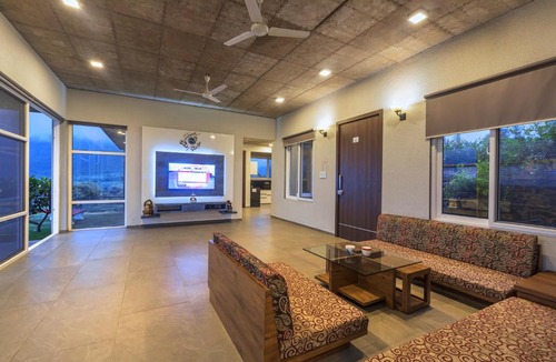 Igatpuri Villa | SaffronStays Serenity - 2BR villa overlooking Lake Kadwa with garden, swings & treks near Sula Vineyard
