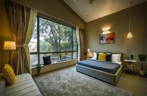 Alibaug Villa | SaffronStays Six Degrees - 6BR pool villa with high-ceiling interiors, lawns, swings & pool table near Awas Beach
