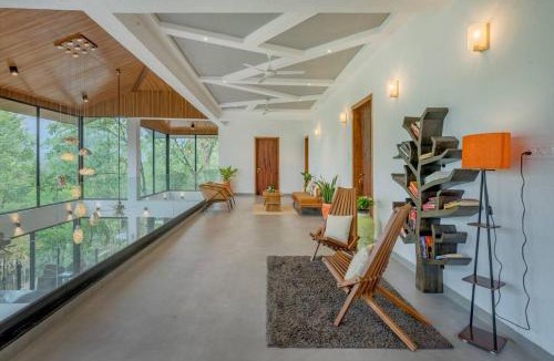 Lonavala Villa | SaffronStays Sonnet - 4BR veg pool villa with grand piano, theater, lawn & mountain views near Mumbai