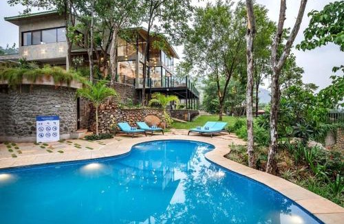 Lonavala Villa | SaffronStays Sonnet - 4BR veg pool villa with grand piano, theater, lawn & mountain views near Mumbai