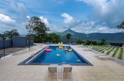 Khalapur Villa | SaffronStays Sundowner - 8BR Morbe-view villa, grand pool, outdoor bar, gazebo, TT & pool table, rain dance, award-winning