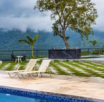 Khalapur Villa | SaffronStays Sundowner - 8BR Morbe-view villa, grand pool, outdoor bar, gazebo, TT & pool table, rain dance, award-winning