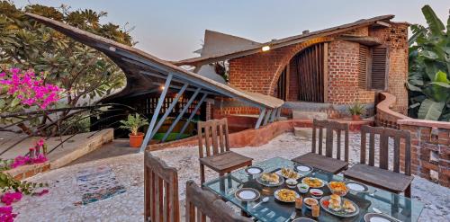Vada Villa | SaffronStays Terracotta Trails - 2BR eco-luxury villa with earthy design, pool, open lawns & sustainable living in Wada