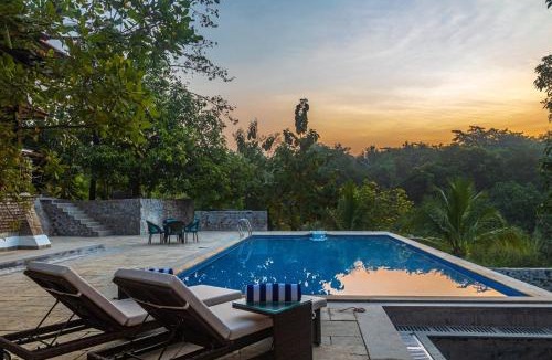 Suryamal Villa | SaffronStays Vedika - 4BR riverfront pool villa with kaya king bullock ride & BBQ near Pinjal River, Vikramgad