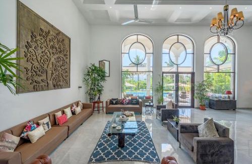 Kadadhe Villa | SaffronStays Zuma Villa - 7BR pet-friendly villa with heated pool, 6000 sqft lawn, play zone & cards room near Pawna Dam