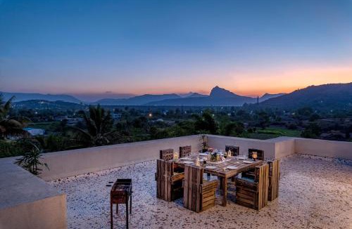 Kadadhe Villa | SaffronStays Zuma Villa - 7BR pet-friendly villa with heated pool, 6000 sqft lawn, play zone & cards room near Pawna Dam