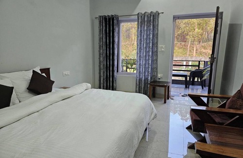 Ramnagar Bed & Breakfast | Spacious Room with Balcony in a Naturalist's Home