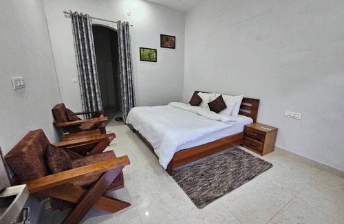 Ramnagar Bed & Breakfast | Spacious Room with Balcony in a Naturalist's Home