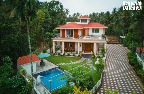 Nagaon Villa | StayVista at 27 Flora with Lawn, Pool, WiFi