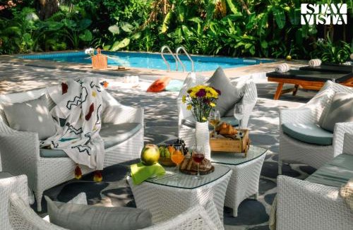 Baga Villa | StayVista at Di Mora by the Sea with Lawn & Pool