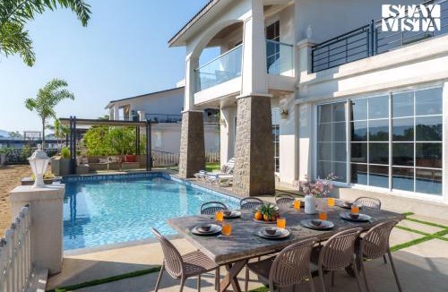 Kurvande Villa | StayVista at Meadows Land with Bonfire