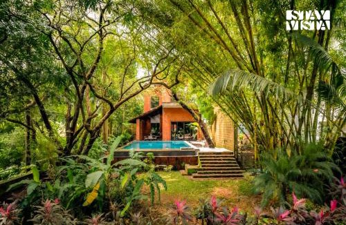 Moira Villa | StayVista at Moira by the River with Bonfire, BBQ