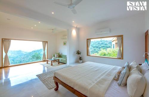 Nathdwara Villa | StayVista at Nilaya In The Hills with Lake View, Pool