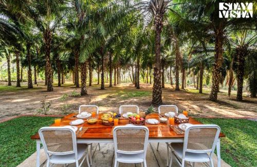 Virajpet House | StayVista at Nomad's Nook with Lawn, River View