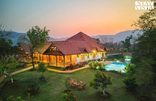 Sangavi Villa | StayVista at Orchard by the River with Bonfire, BBQ