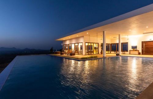 Igatpuri Villa | StayVista at Sunset on the Lake - Infinity Lakeview Swimming Pool with Contemporary Interiors & Lavish Amenities