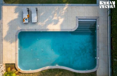 Parshwapuram Villa | StayVista at Terra Palms with Pool, BBQ