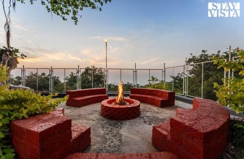 Panhala Villa | StayVista at The Redstone Villa with Bar, Lawn & Pool