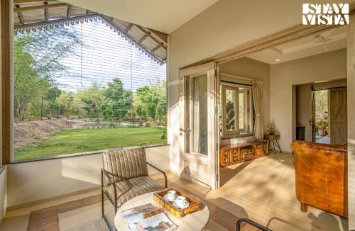 Turiya Villa | StayVista at Vannraj Farm Villa with Shared Pool & Bonfire