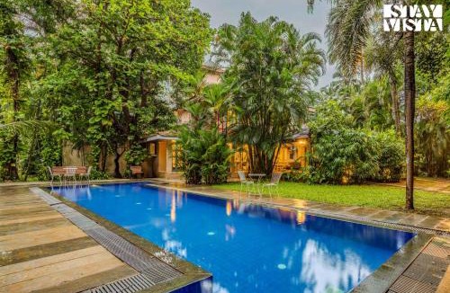 Grand Morrod Villa | StayVista at Villa Nimaya with Lawn & Pool