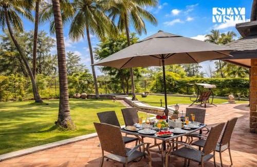 Akshi Villa | StayVista at Waves by the Beach with Beach Access, Pool, Lawn