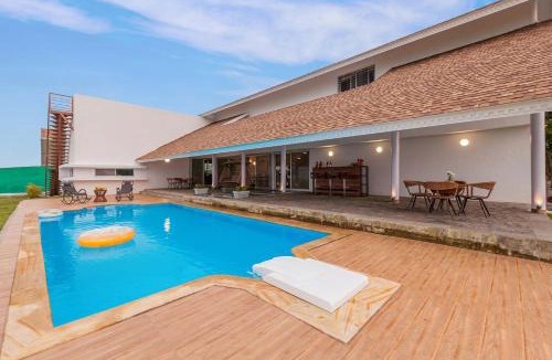 Nashik Villa | StayVista's Eva Villa - Lakeside Luxury with Modern Decor, Pool & Expansive Lawn - Near Sula