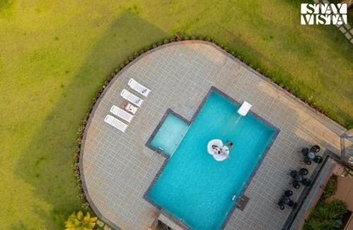 Vaijanath Villa | StayVista's Hillside Meadows - Mountainside Retreat with Farm View, Pool & Deck, Lawn & Gazebo