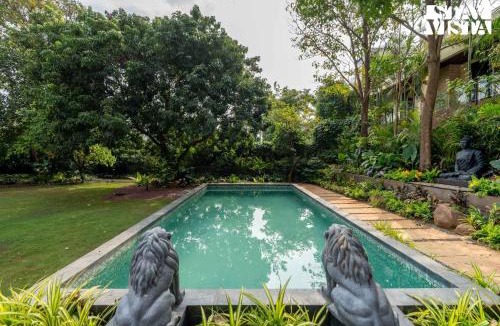 Parshwapuram Villa | StayVista's House Of J - Embrace Leisure with Lawn, Pool, and Gazebo