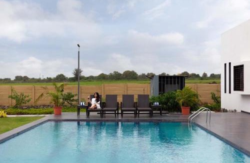 Nashik Villa | StayVista's Le Bon Horizon - Hillside Elegance with Chic Interiors, Poolside Serenity & Picturesque Gazebo