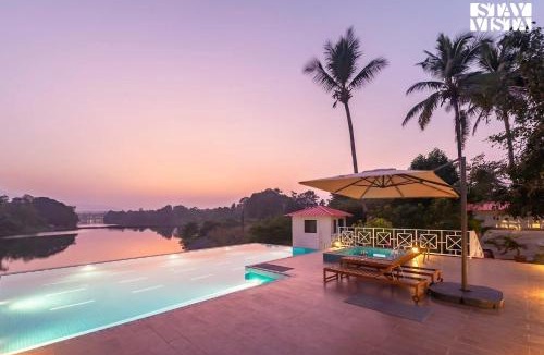 Vada Villa | StayVista's Waterway Retreat - Lakeside Oasis with Infinity Pool