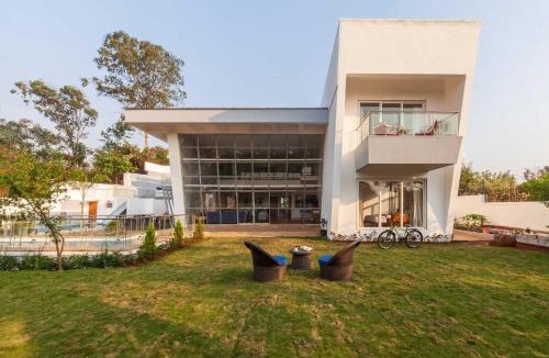 Kune Village Villa | StayVista's White Pebbles - A Villa with Theater Room & Swimming Pool