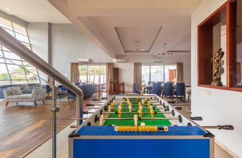 Kune Village Villa | StayVista's White Pebbles - A Villa with Theater Room & Swimming Pool