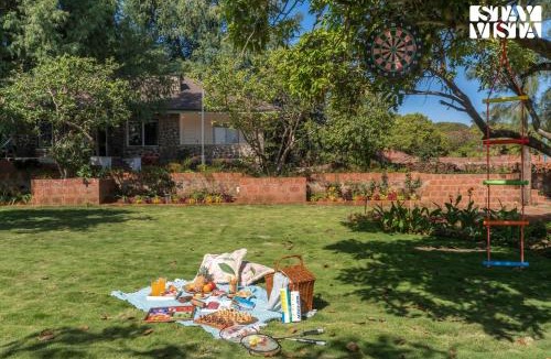 Bajarwadi Villa | The Deck by StayVista - Country house architecture with Valley View