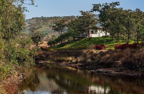 Ambavna Villa | The Lazy River Cottage by cosmicstays