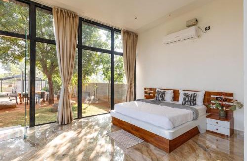 Bhongir Villa | TheSunlitHaven Pool GlassRooms Lawn
