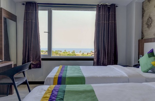 Rushikonda Hotel | Treebo Rushi Grand, 1 km to Rushikonda Beach